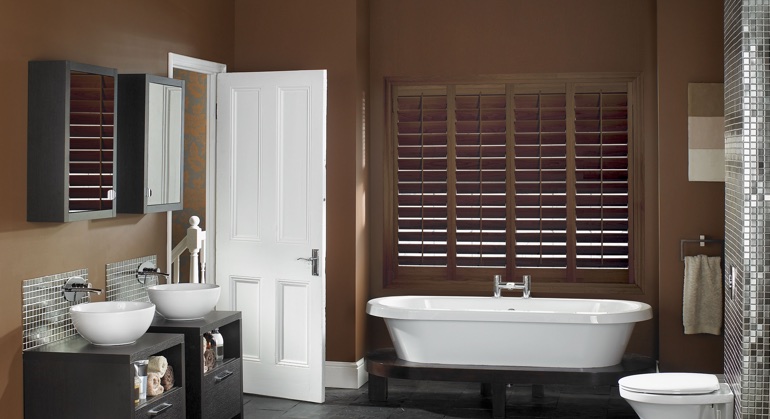 Stained wood shutter in New York restroom